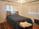 Bedroom with wood flooring and a wood headboard at 6484 Sw 111Th Pl, Ocala, FL 34476