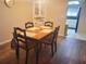 Dining area with a corner hutch and wood flooring at 6484 Sw 111Th Pl, Ocala, FL 34476
