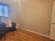 Spacious bedroom with wood flooring and large window at 6484 Sw 111Th Pl, Ocala, FL 34476