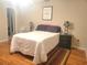 Bright bedroom with a double bed and wood floors at 6484 Sw 111Th Pl, Ocala, FL 34476