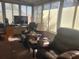Bright sunroom with two comfy leather recliners at 6484 Sw 111Th Pl, Ocala, FL 34476