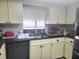 Kitchen features granite countertops and stainless steel appliances at 6484 Sw 111Th Pl, Ocala, FL 34476