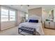 Bedroom with large windows, plush bedding, and ample natural light at 8563 Pinecrest Trl, Wildwood, FL 34785