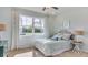 Bright bedroom featuring a comfortable bed and ample natural light at 8563 Pinecrest Trl, Wildwood, FL 34785