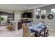 Modern kitchen with stainless steel appliances and granite countertops at 8563 Pinecrest Trl, Wildwood, FL 34785