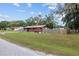 Side view of the house with yard and fence at 1335 Ne 33Rd St, Ocala, FL 34479