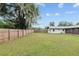 Large backyard with fence and trees at 1335 Ne 33Rd St, Ocala, FL 34479