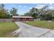 Home's exterior with driveway and landscaping at 1335 Ne 33Rd St, Ocala, FL 34479