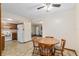 Dining area with wood table and chairs, open to kitchen and living room at 1335 Ne 33Rd St, Ocala, FL 34479
