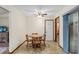 Small dining area with wood table and chairs, adjacent to kitchen at 1335 Ne 33Rd St, Ocala, FL 34479
