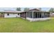 Backyard view of home with screened porch at 1335 Ne 33Rd St, Ocala, FL 34479