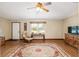 Living room with hardwood floors, ceiling fan, and comfortable seating at 1335 Ne 33Rd St, Ocala, FL 34479