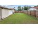 Fenced backyard with grassy area at 1335 Ne 33Rd St, Ocala, FL 34479