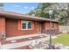 House entrance with orange shutters and rock landscaping at 1335 Ne 33Rd St, Ocala, FL 34479