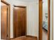 Simple hallway with wood flooring and access to other rooms at 1335 Ne 33Rd St, Ocala, FL 34479