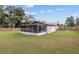 Large backyard with screened porch at 1335 Ne 33Rd St, Ocala, FL 34479
