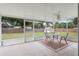 Relaxing screened porch with outdoor seating at 1335 Ne 33Rd St, Ocala, FL 34479