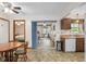 Cozy dining area with wood table and chairs, and access to kitchen at 1335 Ne 33Rd St, Ocala, FL 34479