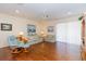 Spacious living room with hardwood floors, a ceiling fan, and comfortable seating at 15659 Sw 13Th Cir, Ocala, FL 34473