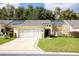 Single story home with two car garage and landscaped lawn at 15659 Sw 13Th Cir, Ocala, FL 34473