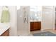 Updated bathroom with double vanity, walk-in shower, and convenient linen closet at 15659 Sw 13Th Cir, Ocala, FL 34473