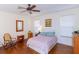 Bright bedroom with wood floors, ceiling fan, and a relaxing atmosphere at 15659 Sw 13Th Cir, Ocala, FL 34473