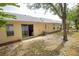 Private backyard with sliding glass door access at 15659 Sw 13Th Cir, Ocala, FL 34473