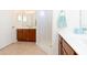 Clean bathroom with double vanity, shower stall, and plenty of counter space at 15659 Sw 13Th Cir, Ocala, FL 34473