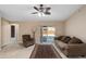 Bright living room with sliding glass doors and neutral color palette at 3107 Ne 24 Pl, Ocala, FL 34470
