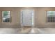 Entryway with carpet flooring and two windows at 3107 Ne 24 Pl, Ocala, FL 34470
