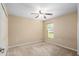 Simple bedroom with ceiling fan and window at 3107 Ne 24 Pl, Ocala, FL 34470