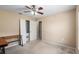 Bright bedroom with a workspace and ample closet space at 3107 Ne 24 Pl, Ocala, FL 34470