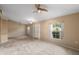 Spacious living room with vaulted ceiling and chandelier at 3107 Ne 24 Pl, Ocala, FL 34470