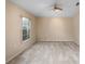 Large living room with carpeted floors and ceiling fan at 3107 Ne 24 Pl, Ocala, FL 34470