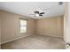 Spacious bedroom with ceiling fan and carpeted flooring at 3107 Ne 24 Pl, Ocala, FL 34470