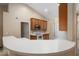 Kitchen boasts a curved breakfast bar and ample cabinetry at 3107 Ne 24 Pl, Ocala, FL 34470