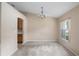 Dining room with carpeted floor and chandelier at 3107 Ne 24 Pl, Ocala, FL 34470