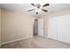 Bedroom with double door closet and ceiling fan at 3107 Ne 24 Pl, Ocala, FL 34470