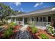 Landscaped front yard with a charming walkway to the porch at 5537 Sw 38 St, Ocala, FL 34474