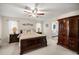 Spacious main bedroom with wood furniture and large walk-in closet at 5537 Sw 38 St, Ocala, FL 34474