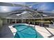 Relaxing kidney shaped pool with covered patio area at 5537 Sw 38 St, Ocala, FL 34474