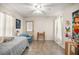 Small bedroom with twin-size bed, tiled floors and window access at 5537 Sw 38 St, Ocala, FL 34474