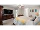 Main bedroom with large TV, dresser, and comfortable bedding at 5537 Sw 38 St, Ocala, FL 34474
