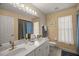 Double vanity bathroom with marble countertop at 5537 Sw 38 St, Ocala, FL 34474