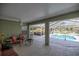Covered patio overlooking a refreshing pool and spacious backyard at 5537 Sw 38 St, Ocala, FL 34474