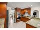 Spacious kitchen with granite countertops and wood cabinets at 5537 Sw 38 St, Ocala, FL 34474