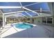 Inviting kidney-shaped pool under a screened enclosure at 5537 Sw 38 St, Ocala, FL 34474