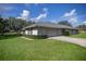 Single story home with attached garage and well-maintained landscaping at 5537 Sw 38 St, Ocala, FL 34474