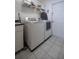 Laundry room with washer, dryer, and shelving at 5537 Sw 38 St, Ocala, FL 34474