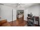 Home office with view into living room, wood floors and built-in desk at 5537 Sw 38 St, Ocala, FL 34474
